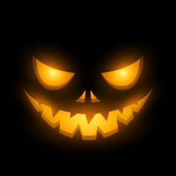 Halloween scary illuminated face in the dark