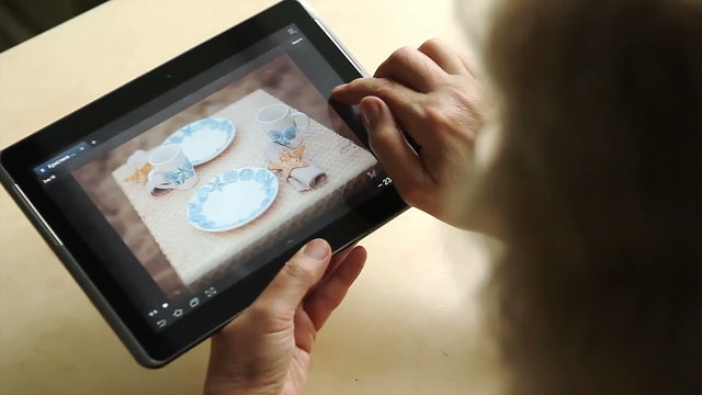 Tablet computer in the hands of an adult woman
