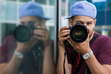 Portrait of photographer with DSLR