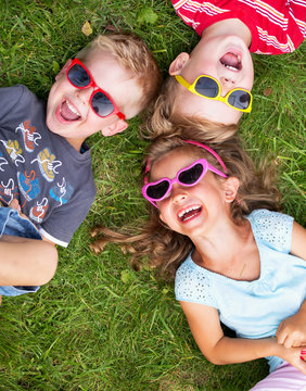 Laughing kids relaxing during summer day
