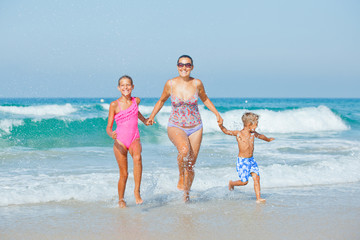 Kids and mother on the beach