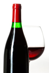Wine bottle and a glass filled with wine isolated on white
