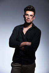 Obraz premium young fashion man with crossed hands