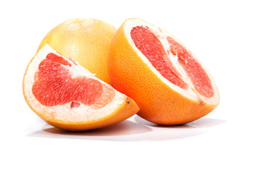 Fototapeta na wymiar Grapefruit, pieces cut apart, isolated on white