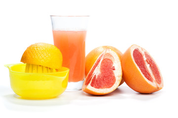 Making grapefruit juice, isolated on white