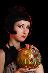 Naklejka premium Halloween woman with a pumpkin