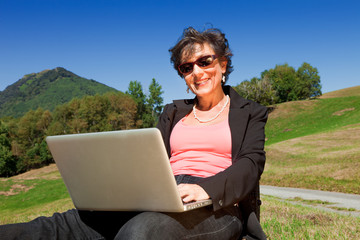 business woman working in the nature
