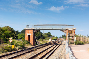 Fototapeta na wymiar Bridge over railway track with blue sky