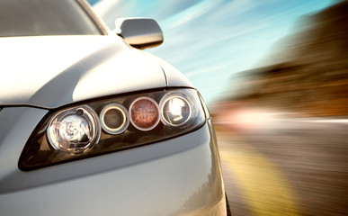 rear side view of a sport car in blurred motion