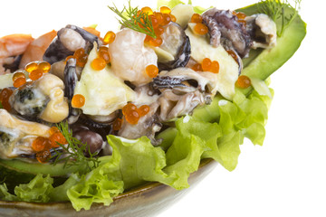 Seafood salad with red caviar in avocado