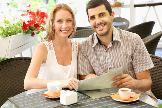 Young couple relaxing in a cafe