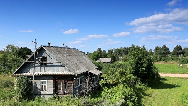 Movement of clouds over the old Russian wooden houses. Dvorets, 