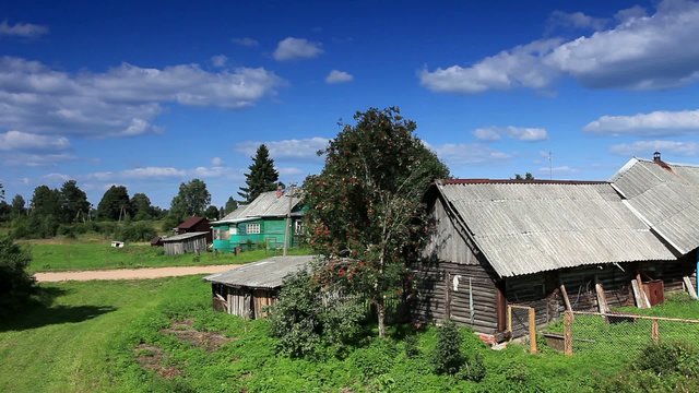 Movement of clouds over the old Russian wooden houses. Dvorets, 