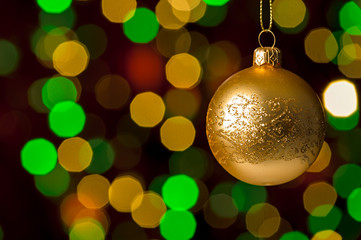 Christmas ball hanging defocused sparkling lights