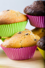 Muffins - homemade cupcakes in colorful molds