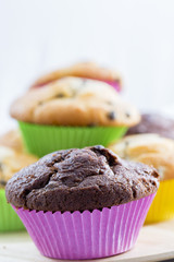 Muffins - homemade cupcakes in colorful molds