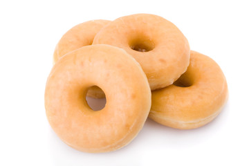 Four doughnuts or donuts piled isolated on white.