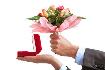Marriage proposal with ring and flowers