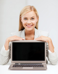 smiling woman with laptop pc