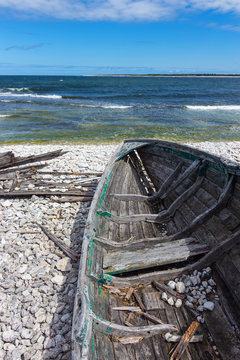 Old wooden boat on the seashore