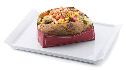 Baked potato with chicken, sausage, corn, black olive