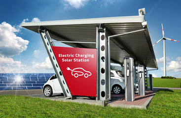 Electric Car at Electric Solar Charging Station + Photovoltaics