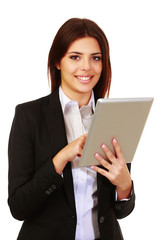 Happy young businesswoman using electronic tablet
