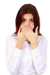 surprised woman with hands over her mouth isolated on white