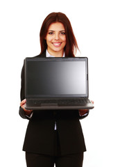 Smiling businesswoman showing computer display