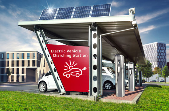 E-Cars on Electric Solar Charging Station with City Buildings