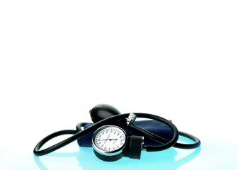 Sphygmomanometer on blue, reflective background