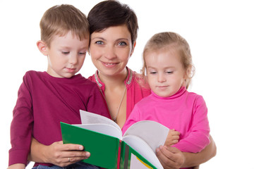 Fototapeta na wymiar Son and daughter listening their mother reading book