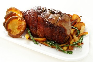 Roast beef joint with vegetables and Yorkshire pudding