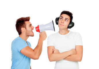 Young men screams to his friend through a megaphone