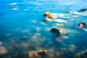 Fototapeta premium Rock in the still water