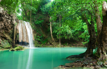 Fototapeta na wymiar Blue stream waterfall in Kanjanaburi Thailand (Erawan waterfall