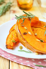 slices of roasted pumpkin with rosemary