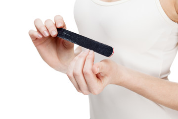 young blond woman holding nail file