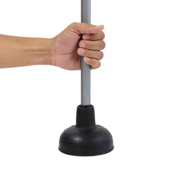 Holding black rubber plunger for toilet pump isolated over white