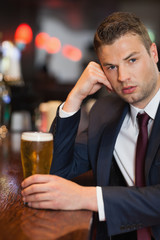 Worried businessman having a drink
