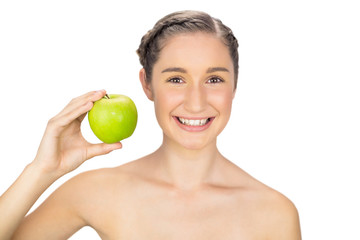 Cheerful healthy model holding green apple
