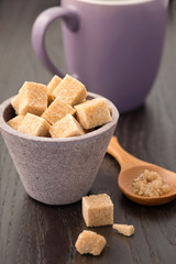 Brown sugar cubes in a ceramic dish