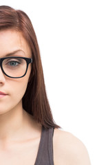 Obraz premium Half face of young woman wearing glasses posing