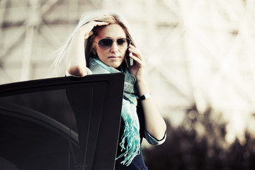 Blond woman calling on the mobile phone