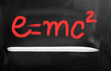 E=mc2 handwritten with chalk on a blackboard