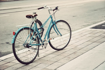 Women's bicycle parked on the street