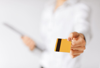 woman showing gold credit card