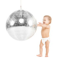 toddler playing with disco ball