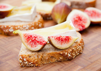 Whole grain bread with melted brie cheese and figs.