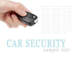 Hand holding car keys isolated on white background